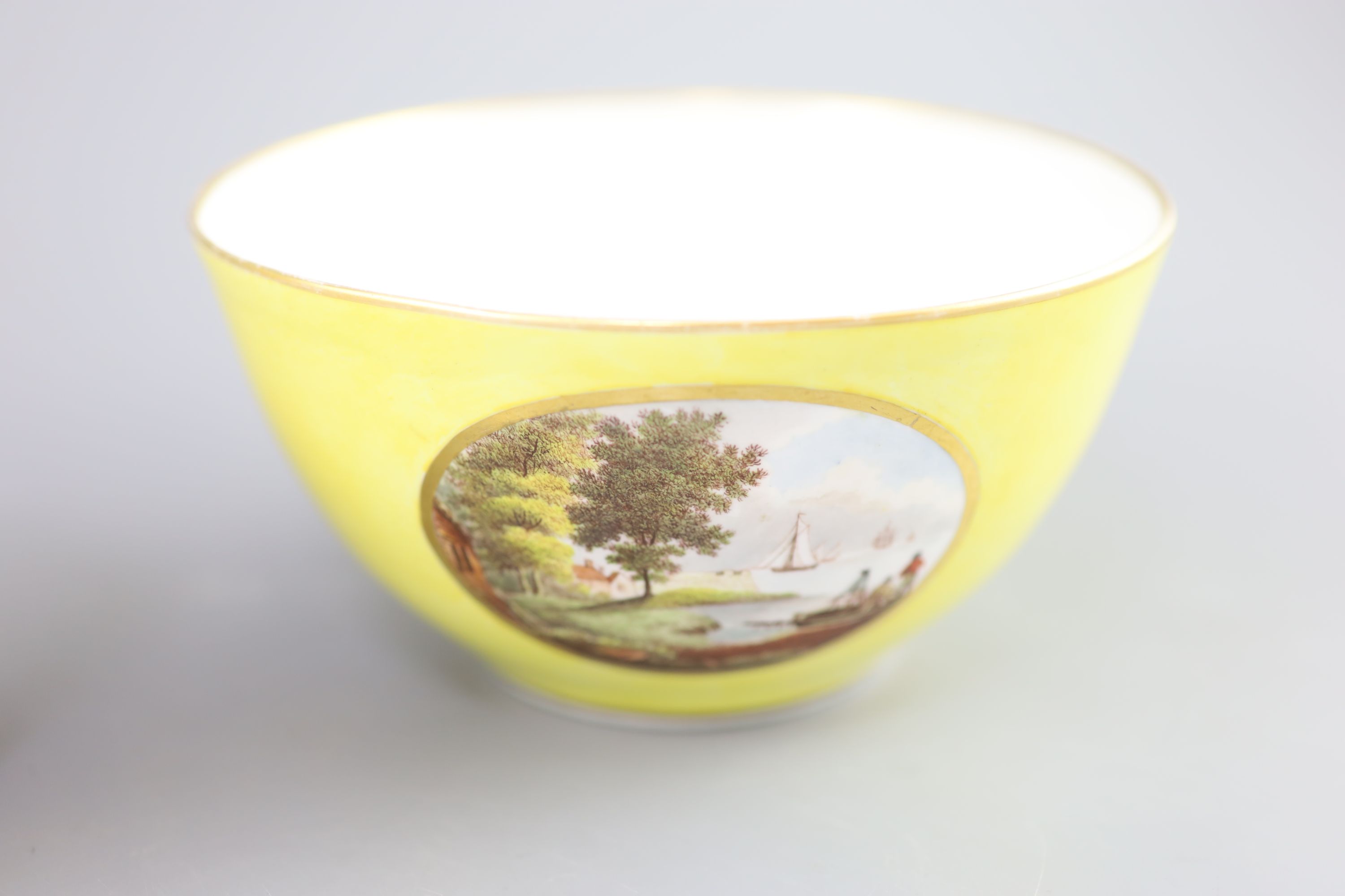 A Derby yellow ground topographical slops bowl and a similar bough pot, c.1790-1800, 19.5 cm wide